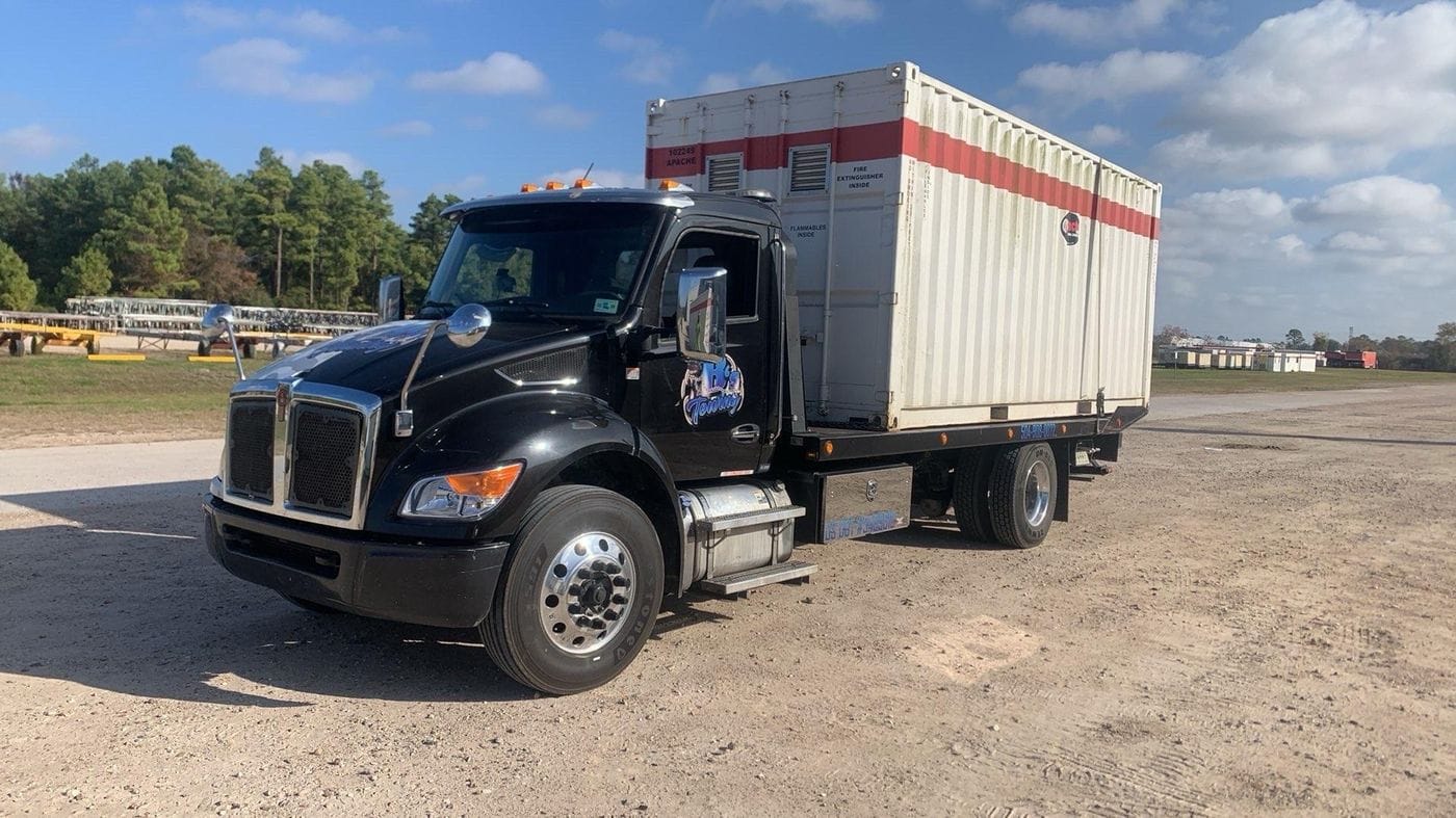 Box truck on a dirt lot