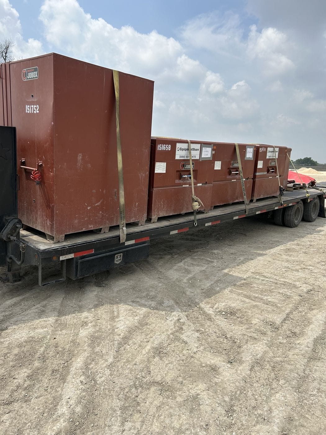 Flatbed trailer loaded with stacked steel material