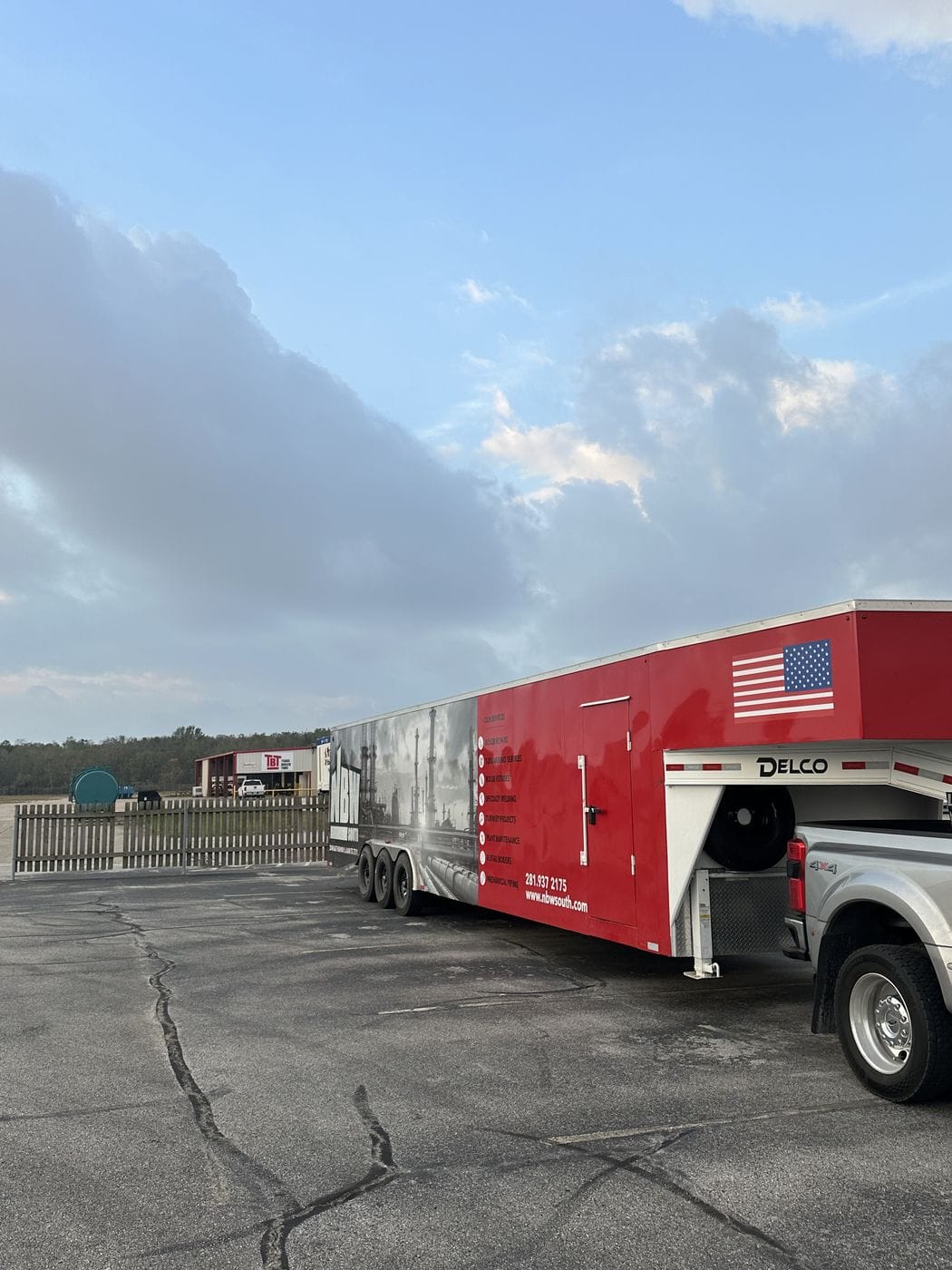 Box truck parked at a warehouse