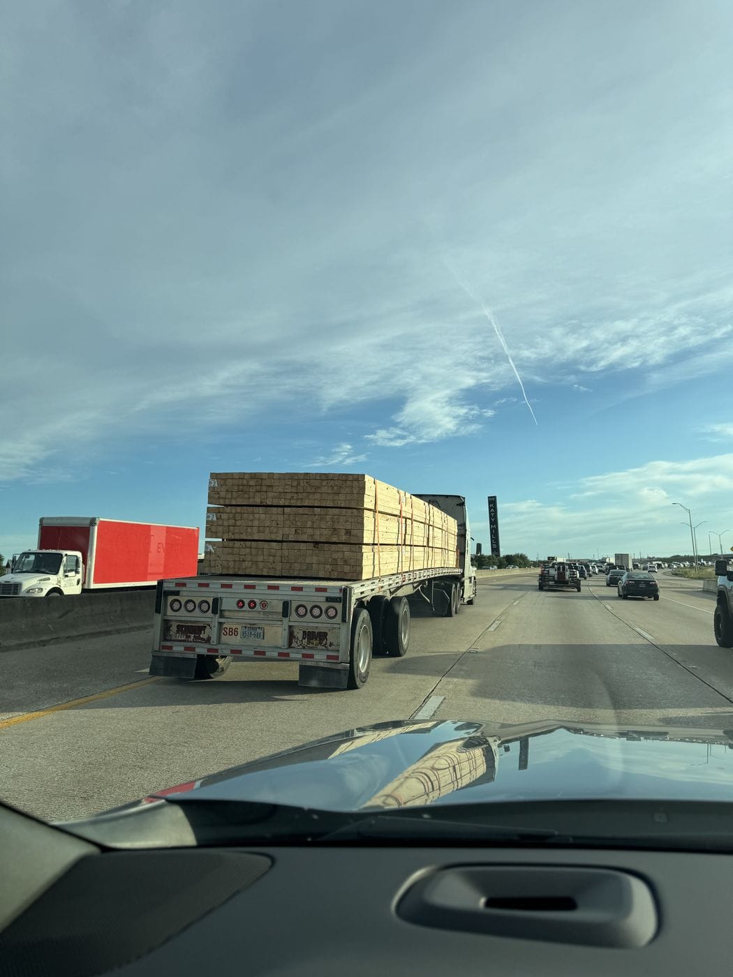 View from a truck cab of a loaded trailer ahead