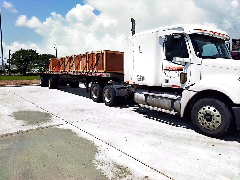 Semi-truck hauling a loaded dump trailer